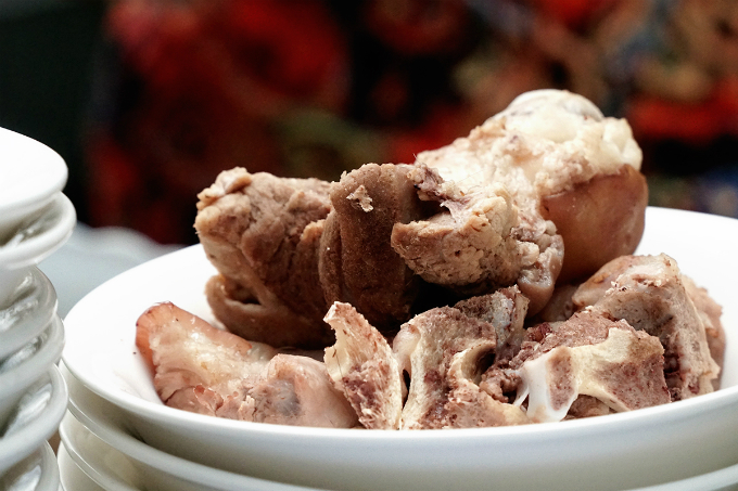 Hanh simmer 20 kilograms of bones for two hours to make the broth before adding the beef ball. Customers can also order different part of the pork to eat with the soup.